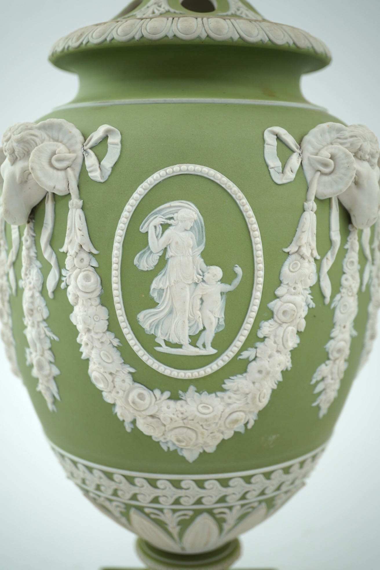 A Wedgwood green jasperware covered pot pourri urn, early 19th century